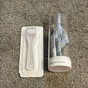 NIB rodan and fields amp roller and cleaning case.